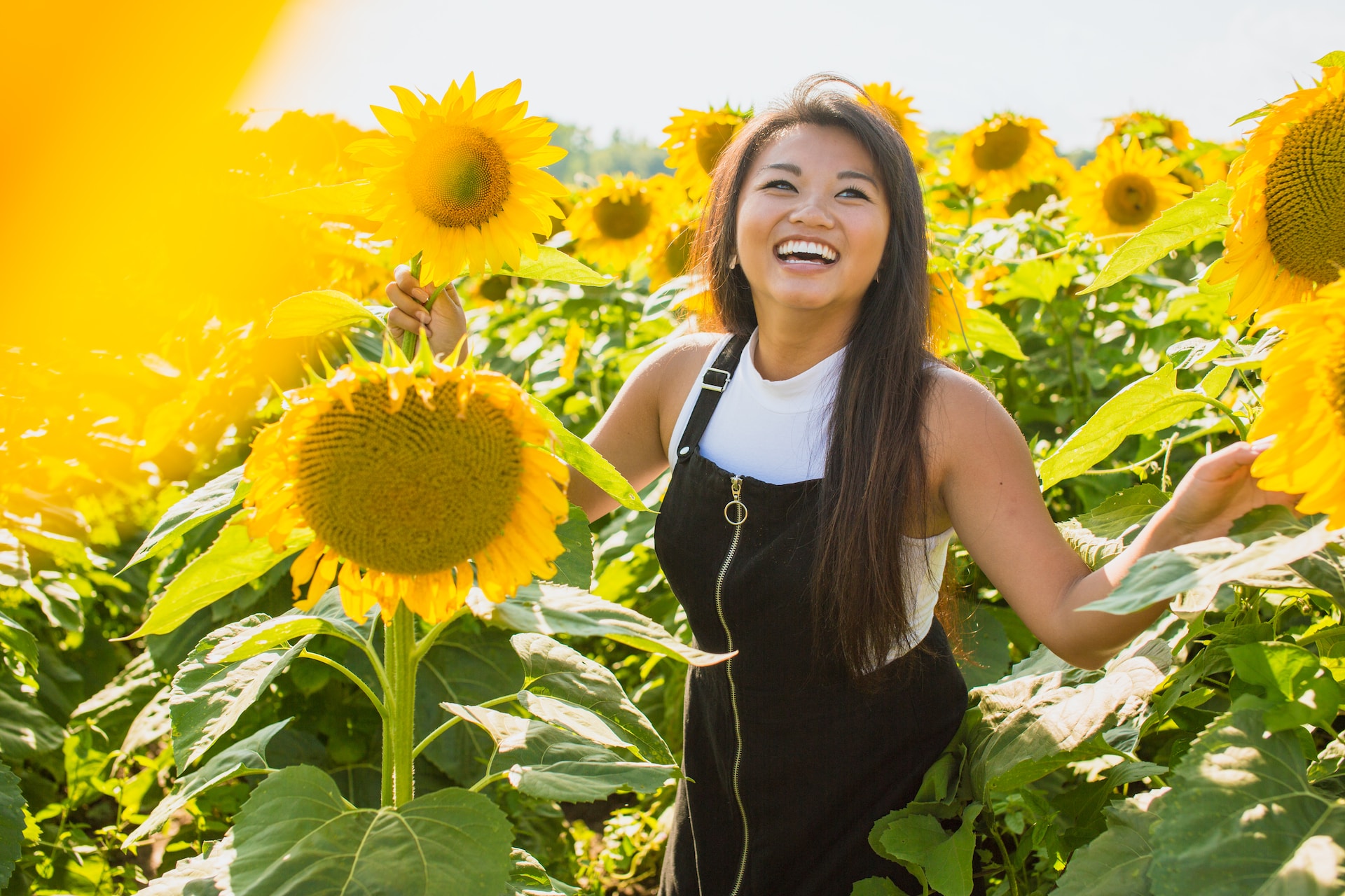 Ottawa woman enjoying the sunflower field with a bright smile